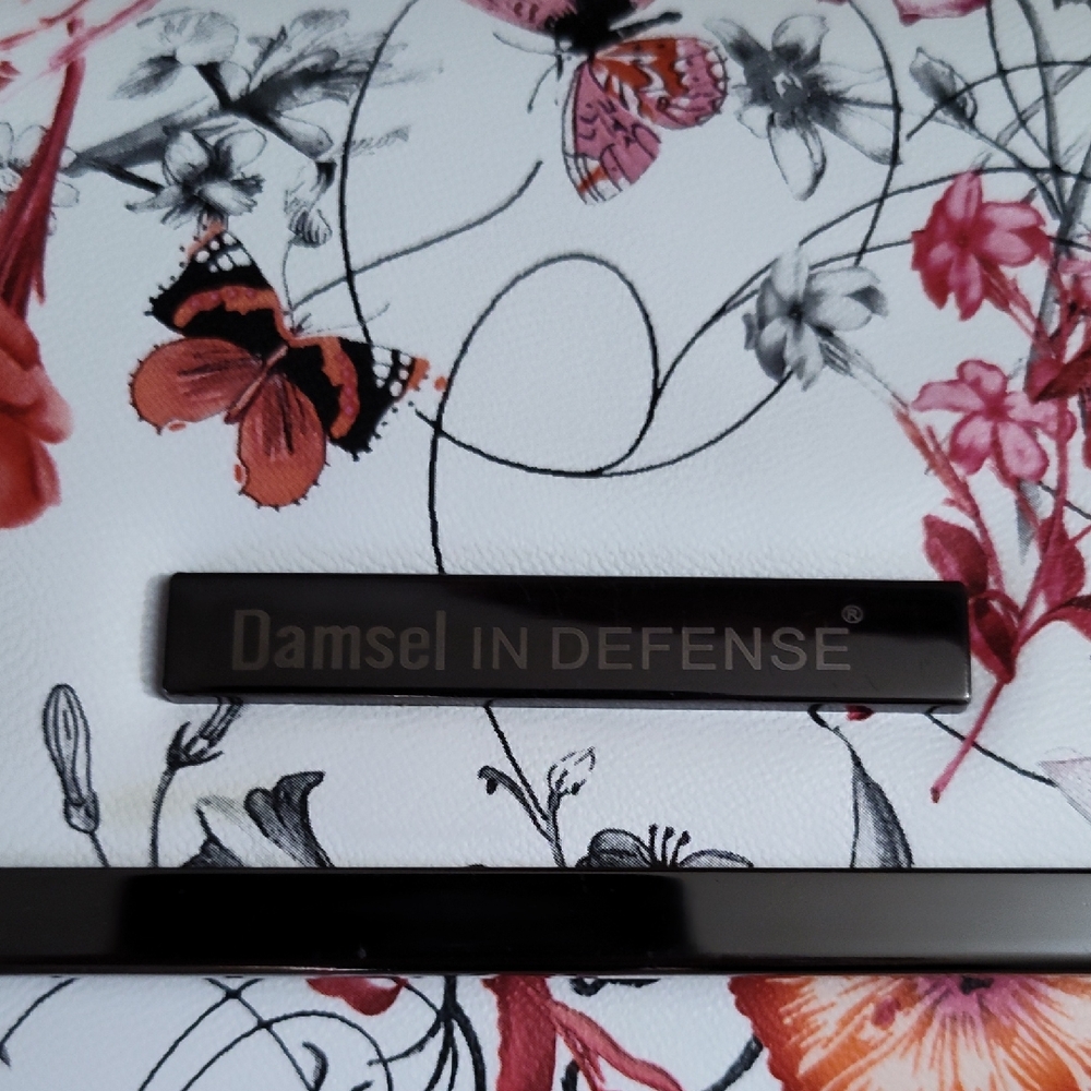 Damsel in Defense Floral Clutch
